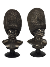 bronze bust statue of a Scots guard soldier wearing their bearskin with detsailed facial features and uniform.
